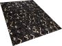 Beliani DEVELI Laagpolig vloerkleed Zwart 140 x 200 cm Koeienhuid leer - Thumbnail 1