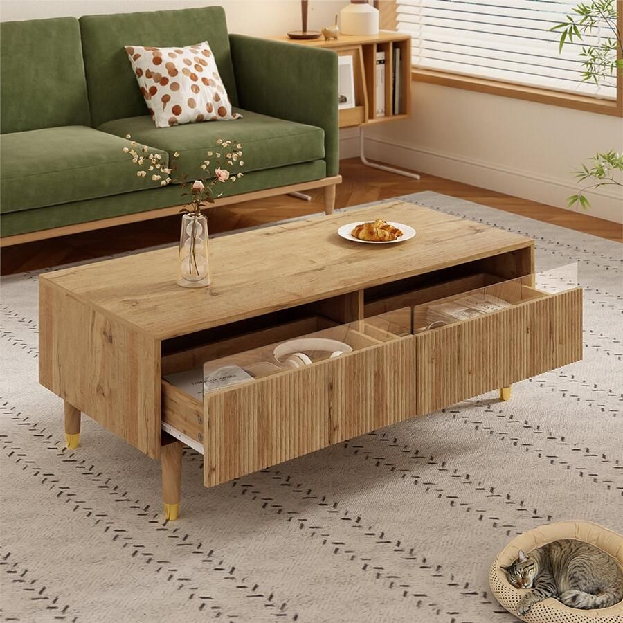 BLACKCOLORS Deze moderne salontafel met ledverlichting heeft een golvend blad met lades goudkleurige poten twee lades en een ledstrip die van kleur verandert