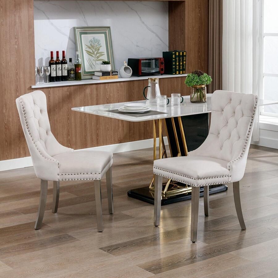 BLACKCOLORS Moderne eetkamerstoel van hoge kwaliteit gemaakt van massief hout met capitonnering bekleed met eigentijds fluweel met verchroomde roestvrijstalen poten spijkerstof set van 2 beige en chroom DE1701BG