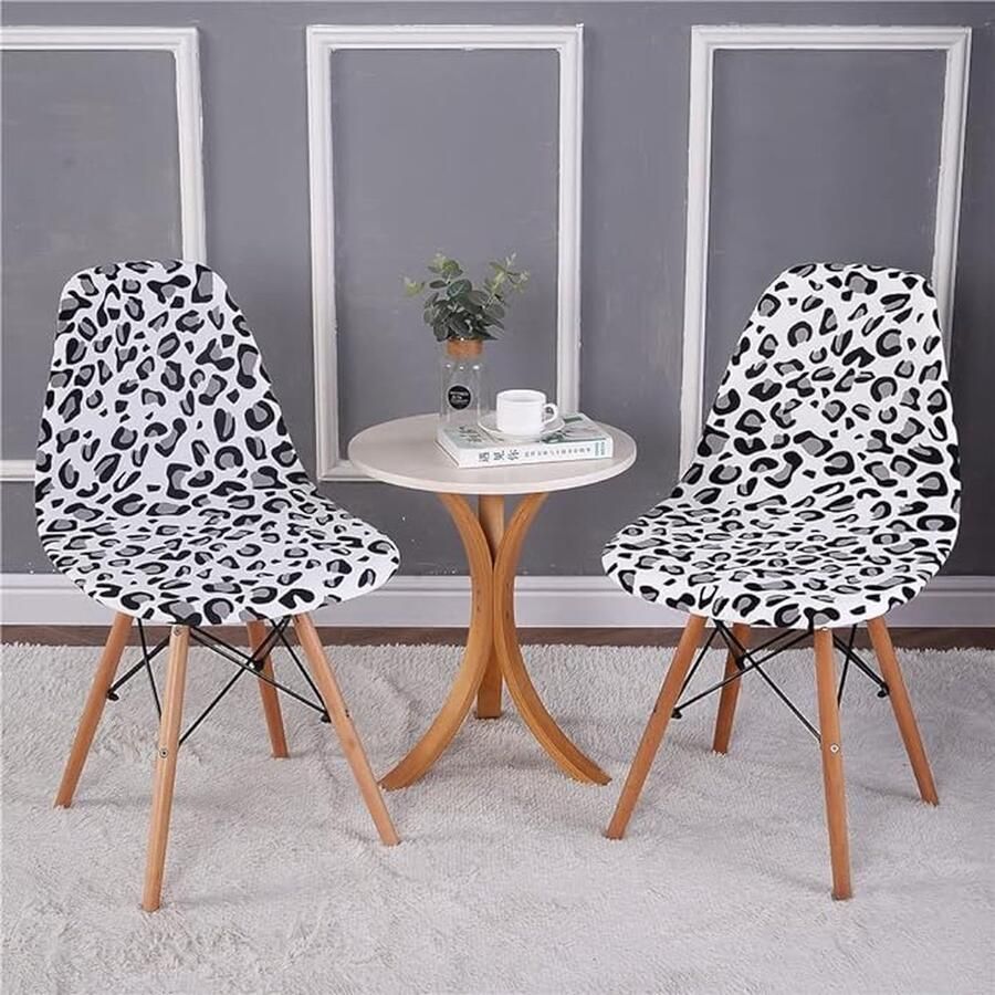CLORD Kuipstoelhoezen verkrijgbaar in sets van 2 4 of 6 stuks. Deze moderne elastische stoelhoezen zijn afneembaar wasbaar en perfect voor eetkamerstoelen. Voeg een vleugje stijl toe aan je interieur met deze witte luipaardprint hoezen