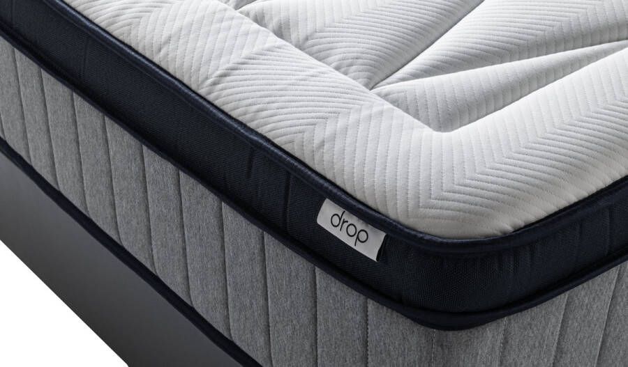 Drop Matras Elysia Hardheid : Medium 30 cm dikke 5 zone pocketveren matras met schuimrand. De top laag is 7 cm HR schuim + 1 cm traagschuim. Antibacteriele hoes