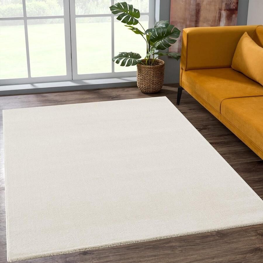 Laagpolig tapijt voor de woonkamer effen modern tapijt crème 60 x 110 cm vloerkleed