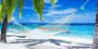 Glazen schilderijen Glasschilderij tropisch strand 120x60 cm Kies zelf je formaat Tropische stranden Schilderij Wanddecoratie Muurdecoratie Woonkamer Slaapkamer Hangmat tussen palmbomen op tropisch strand - Thumbnail 1