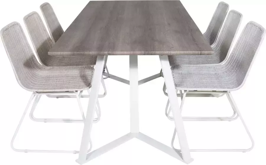 Hioshop MarinaGRWH eethoek eetkamertafel grijs en 6 Cirebon eetkamerstal rotan whitewash.