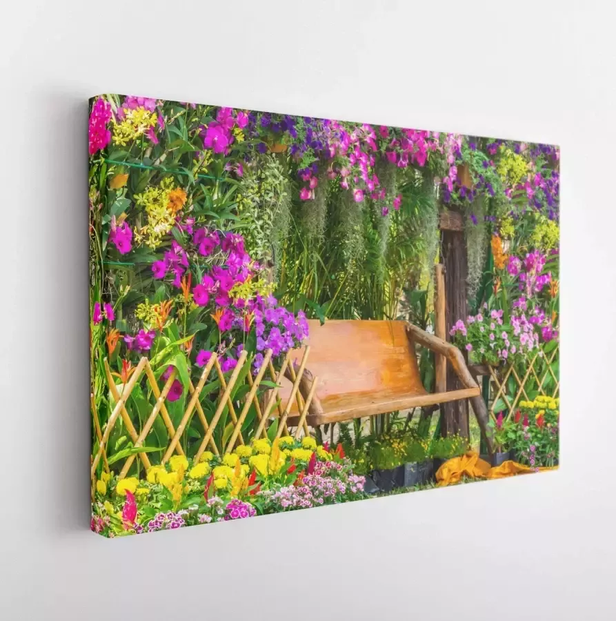 Itsallcanvas Canvas schilderij Wood chair in the flowers garden on summer. Wood chair in the flowers garden 408343288 40*30 Horizontal