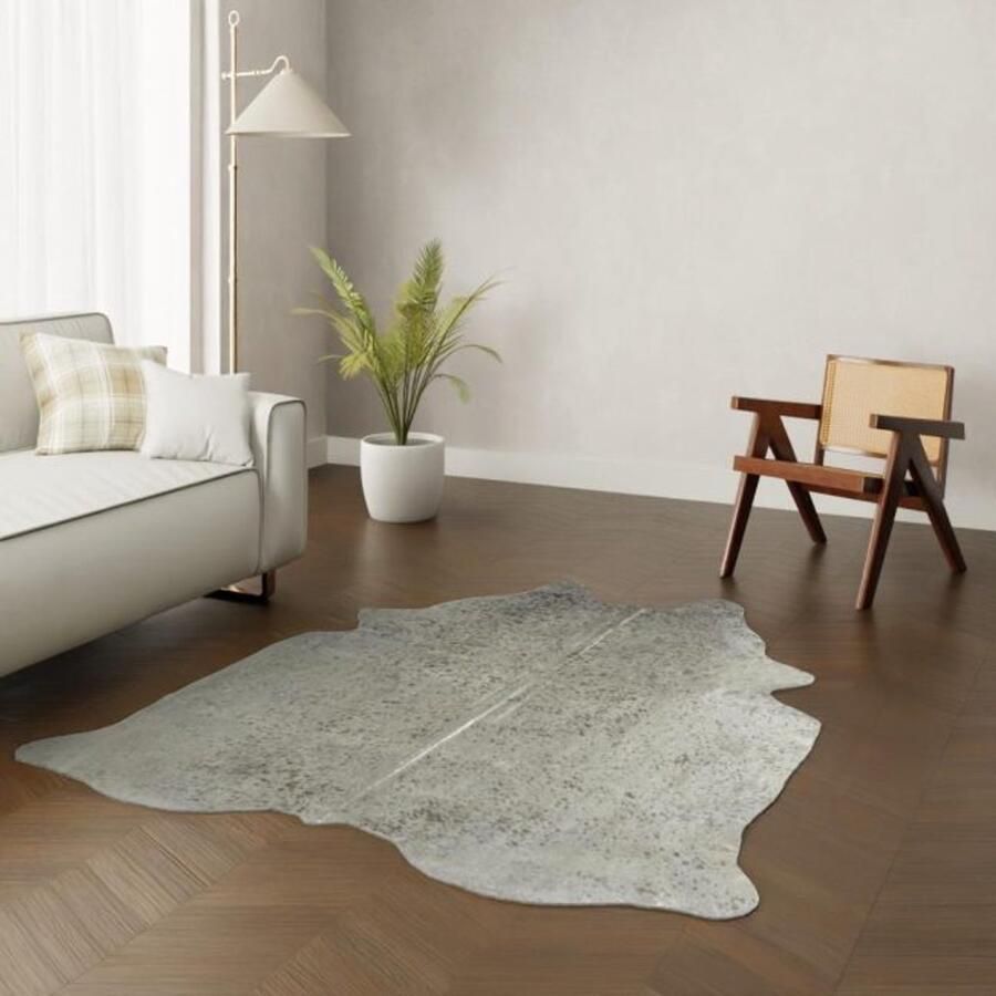Koeienhuidkopen.nl Zilveren koeienhuid Zilver geverfde koehuid vloerkleed Koeienvacht zilvere koeienvel dierenhuid vloerkleed tapijt