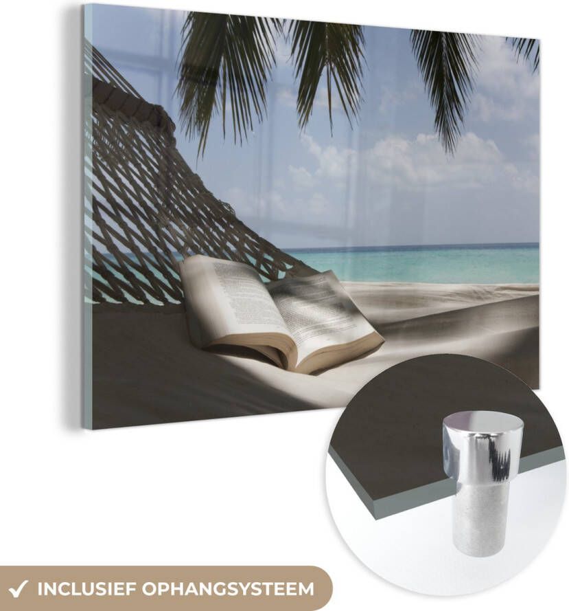 MuchoWow Glasschilderij 120x80 cm Schilderij acrylglas Boek in een hangmat op een tropisch eiland Foto op glas Schilderijen
