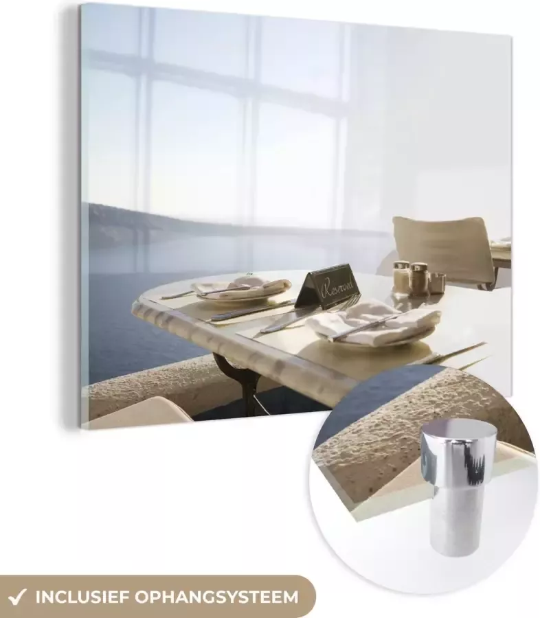 MuchoWow Glasschilderij 120x90 cm Schilderij glas Een gereserveerde restaurant met een tafel en met uitzicht op de zee Foto op acrylglas Schilderijen