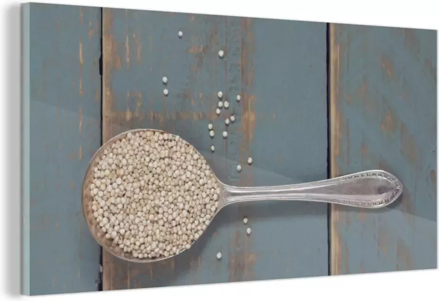 MuchoWow Glasschilderij Een vintage lepel met quinoa op een houten tafel 120x60 cm Acrylglas Schilderijen Foto op Glas