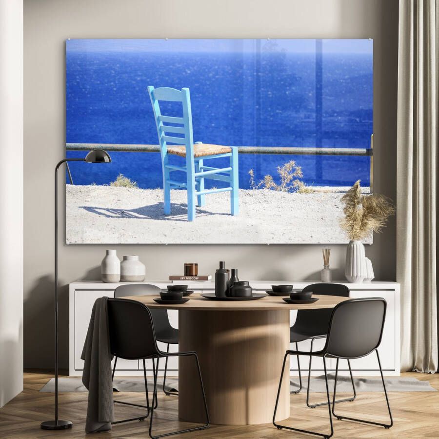 MuchoWow Glasschilderij Uitzicht op de knalblauwe zee en een stoel op Kos 150x100 cm Acrylglas Schilderijen Foto op Glas