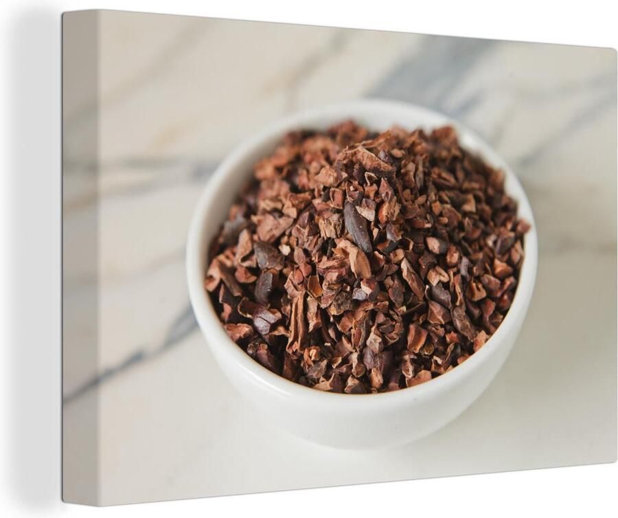 MuchoWow Canvas schilderij 180x120 cm Wanddecoratie Gemalen cacaobonen in een keramische kop op een marmeren tafel Muurdecoratie woonkamer Slaapkamer decoratie Kamer accessoires Schilderijen