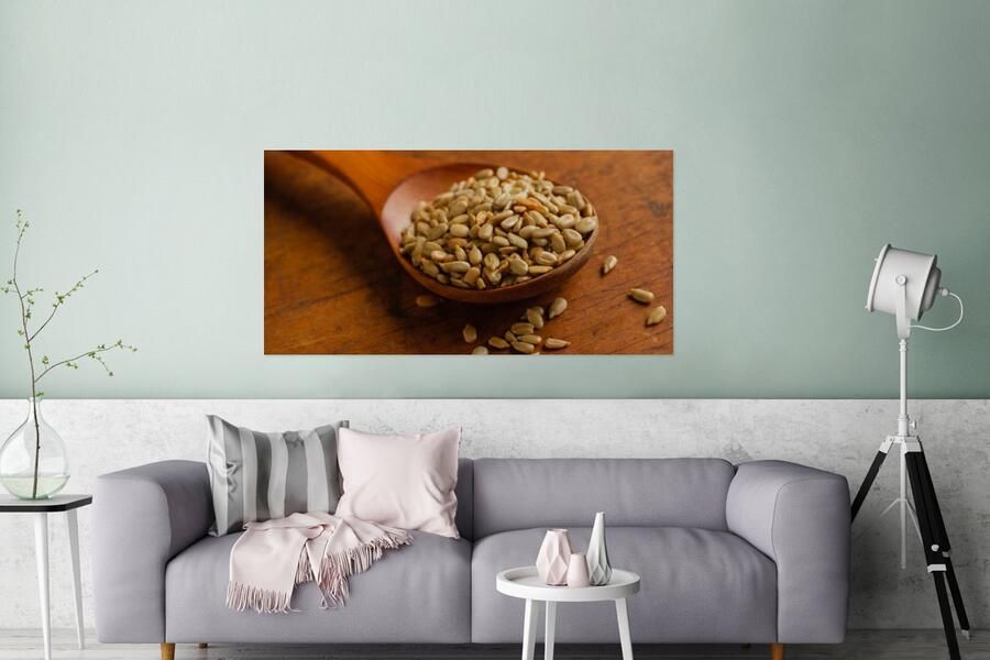 MuchoWow Glasschilderij Houten lepel vol met zonnebloempitten op houten tafel 160x80 cm Acrylglas Schilderijen Foto op Glas