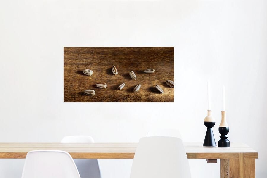 MuchoWow Glasschilderij Tien zonnebloempitten op houten tafel 120x60 cm Acrylglas Schilderijen Foto op Glas