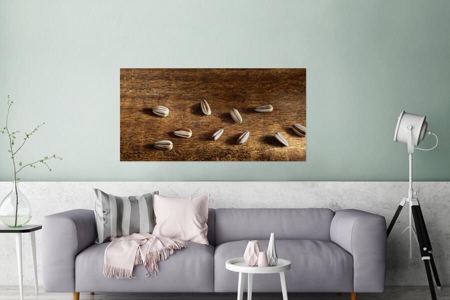 MuchoWow Glasschilderij Tien zonnebloempitten op houten tafel 160x80 cm Acrylglas Schilderijen Foto op Glas