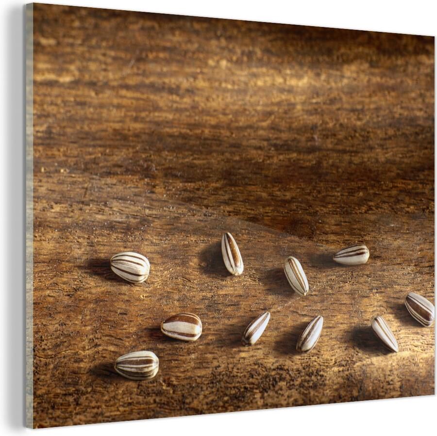 MuchoWow Glasschilderij Tien zonnebloempitten op houten tafel 40x30 cm Acrylglas Schilderijen Foto op Glas
