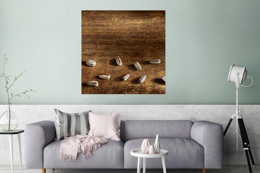 MuchoWow Glasschilderij Tien zonnebloempitten op houten tafel 90x90 cm Acrylglas Schilderijen Foto op Glas