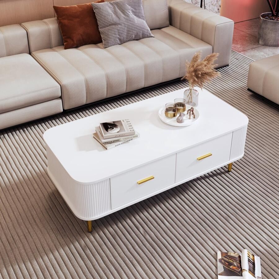 Ojiuboo —Moderne salontafel met geschulpte rand Salontafel met vier laden en gebogen hoeken Wit met gouden poten met handgreep 105x51x38cm