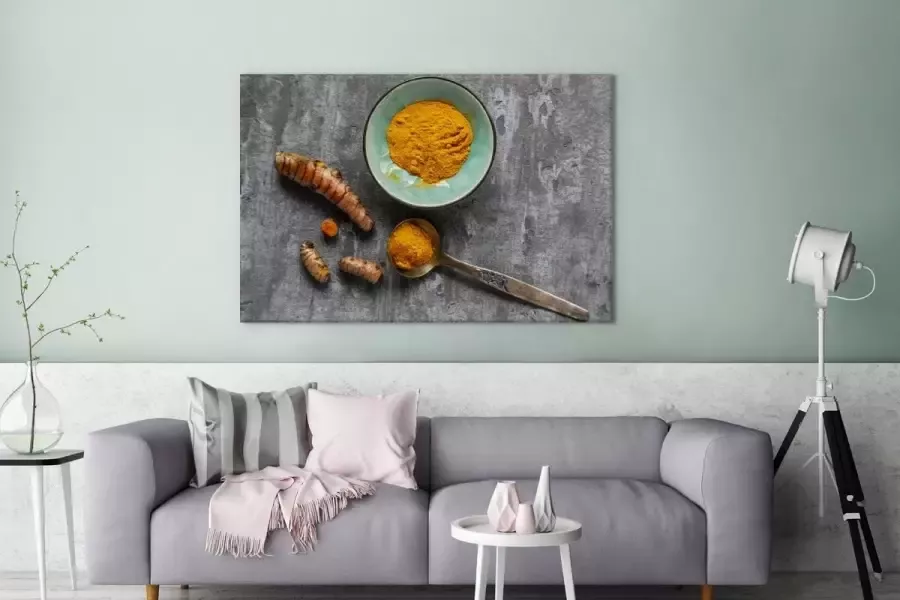 OneMillionCanvasses Canvas Schilderij Decoratieve kom op een stenen tafel met kurkuma 120x80 cm Wanddecoratie