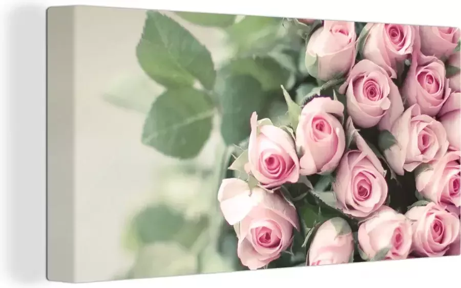 OneMillionCanvasses Canvas schilderij 160x80 cm Wanddecoratie Een grote boek van roze rozen ligt op een tafel. Muurdecoratie woonkamer Slaapkamer decoratie Kamer accessoires Schilderijen