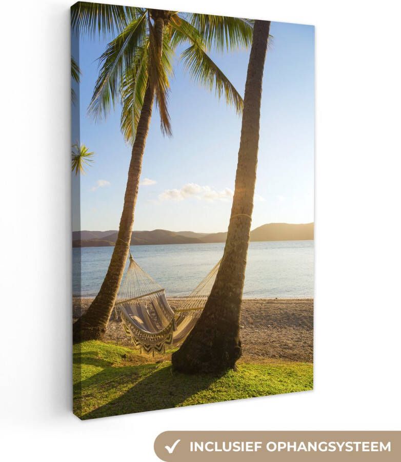 OneMillionCanvasses Twee palmbomen op het strand met een hangmat Canvas 60x90 cm Foto print op Canvas schilderij (Wanddecoratie woonkamer slaapkamer) Zee en Strand