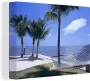OneMillionCanvasses Canvas Schilderij Zee Hangmat Palmboom 80x60 cm Wanddecoratie - Thumbnail 1