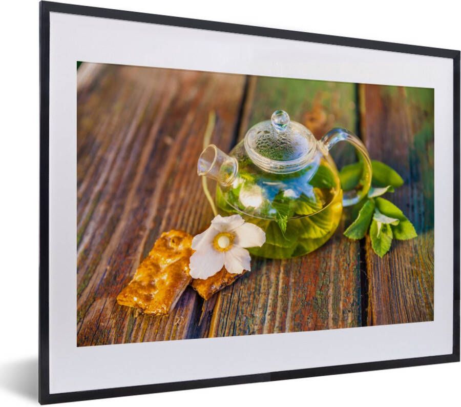 PosterMonkey Fotolijst incl. Poster Glazen theepot op een houten tafel 40x30 cm Posterlijst