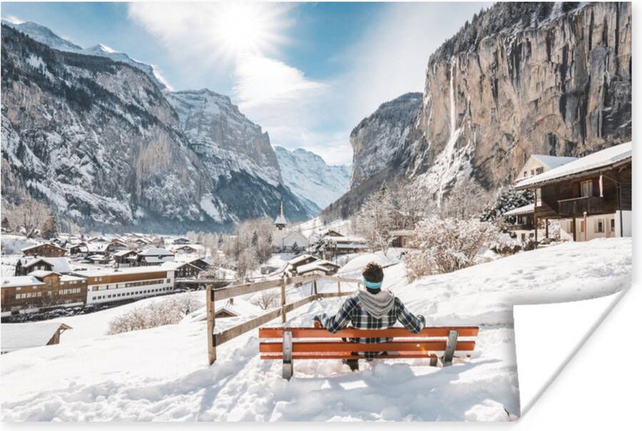 PosterMonkey Poster Man op een bank tijdens de winter in Zwitserland 60x40 cm