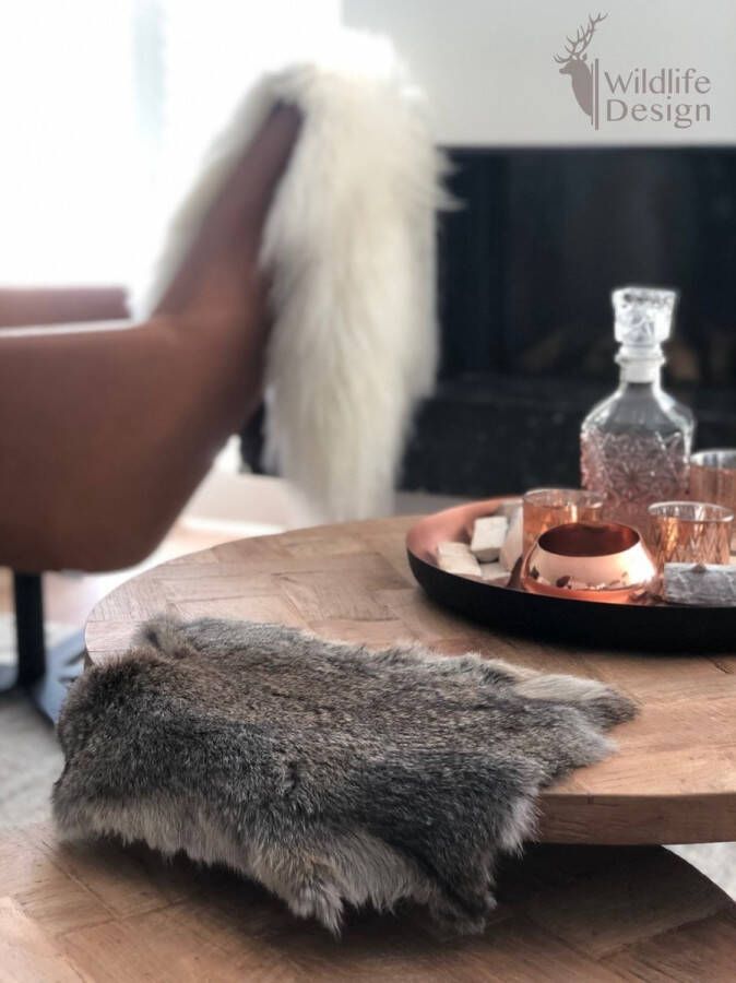 Schapenvachtkopen.nl koeienhuid blauw -blauwe koeienhuid vloerkleed dierenhuid dierenvel bruin koehuid koeienvel tapijt