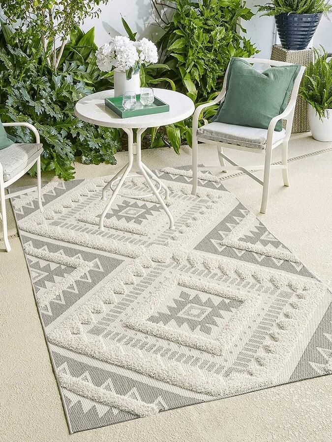 The carpet Karel In & Outdoor is weerbestendig een hoogwaardig vloerkleed (woonkamer) in Boho-design Cream 80 x 150 cm
