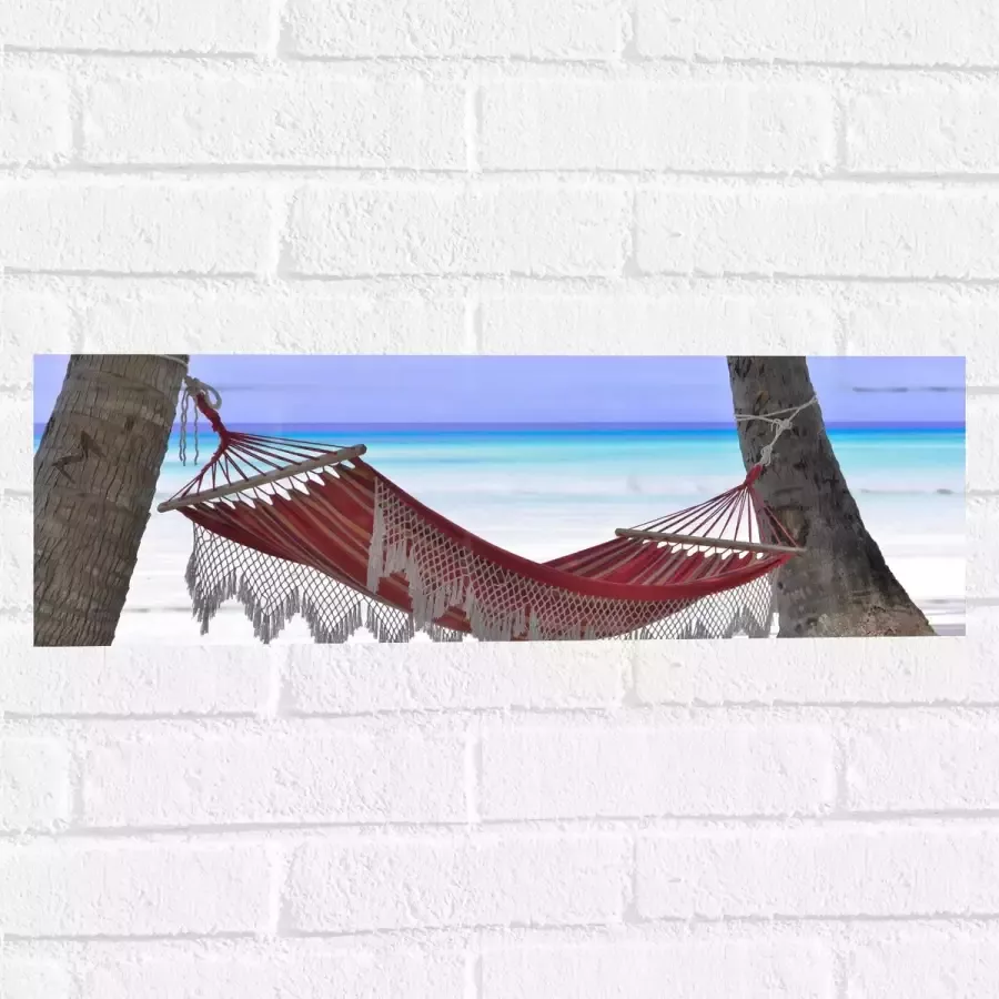 WallClassics Muursticker Rode Ibiza Hangmat op Tropisch Strand 60x20 cm Foto op Muursticker