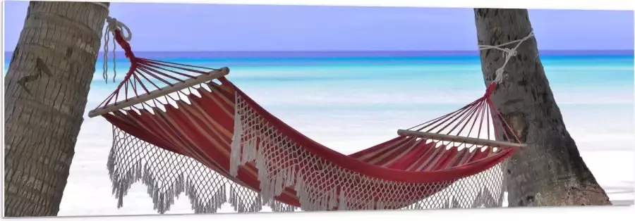 WallClassics PVC Schuimplaat- Rode Ibiza Hangmat op Tropisch Strand 150x50 cm Foto op PVC Schuimplaat